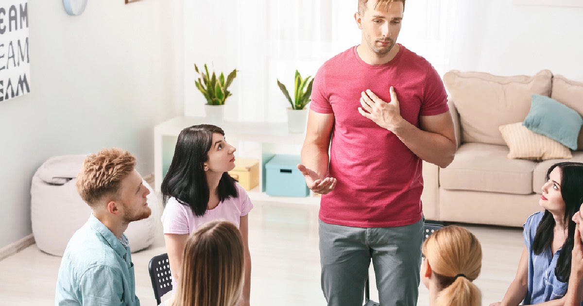 Man sharing during group therapy session 