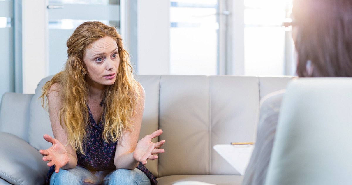 Psychologist talking with a female who is feeling depressed 