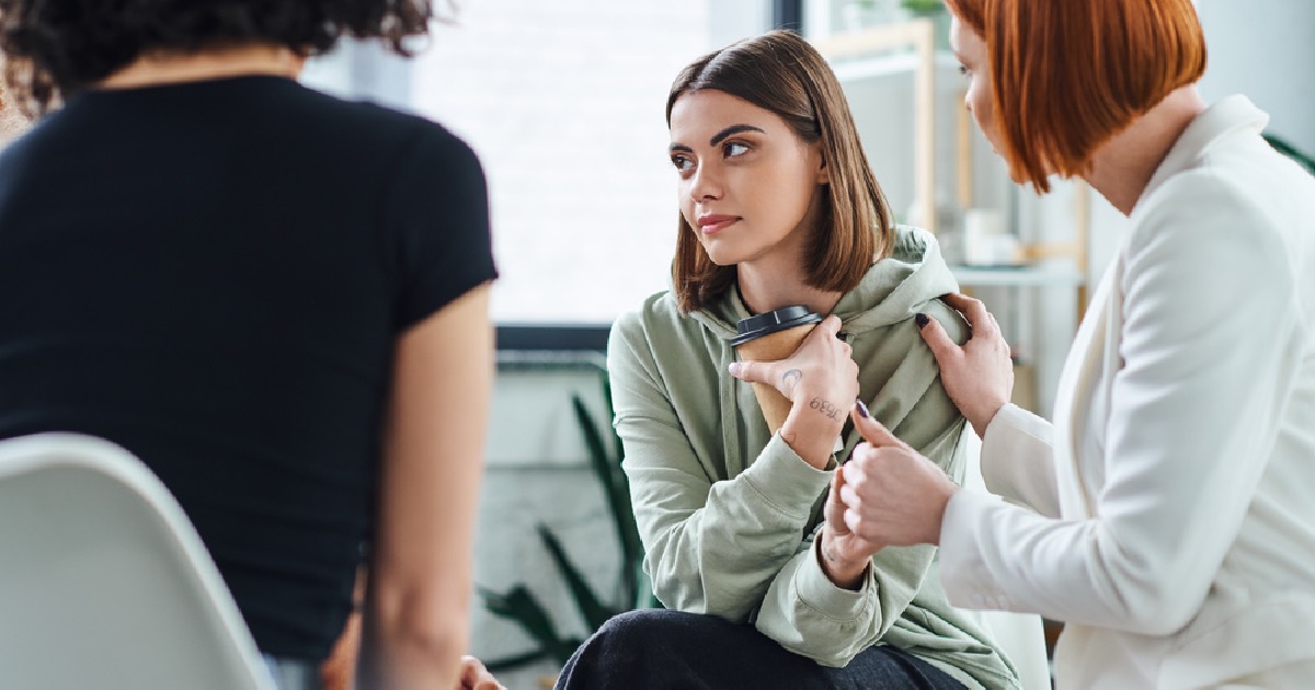 Psychologist working with young woman 