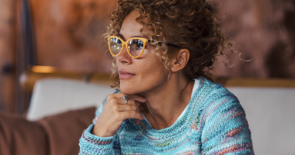 Woman wearing glasses looking peaceful