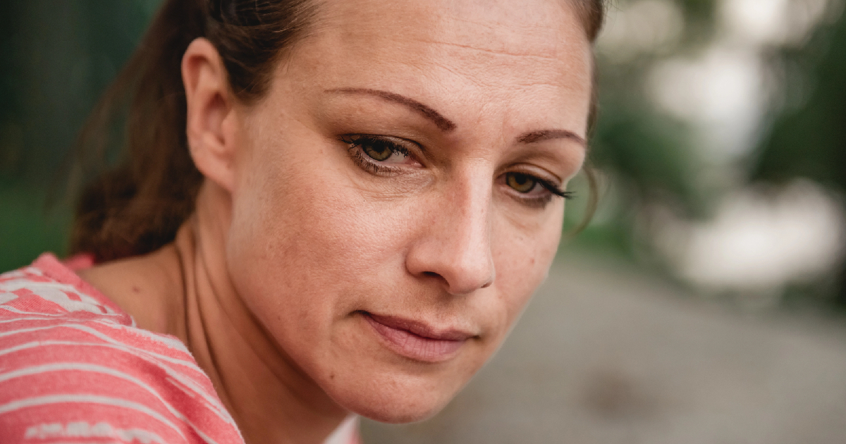 Tired woman looking down