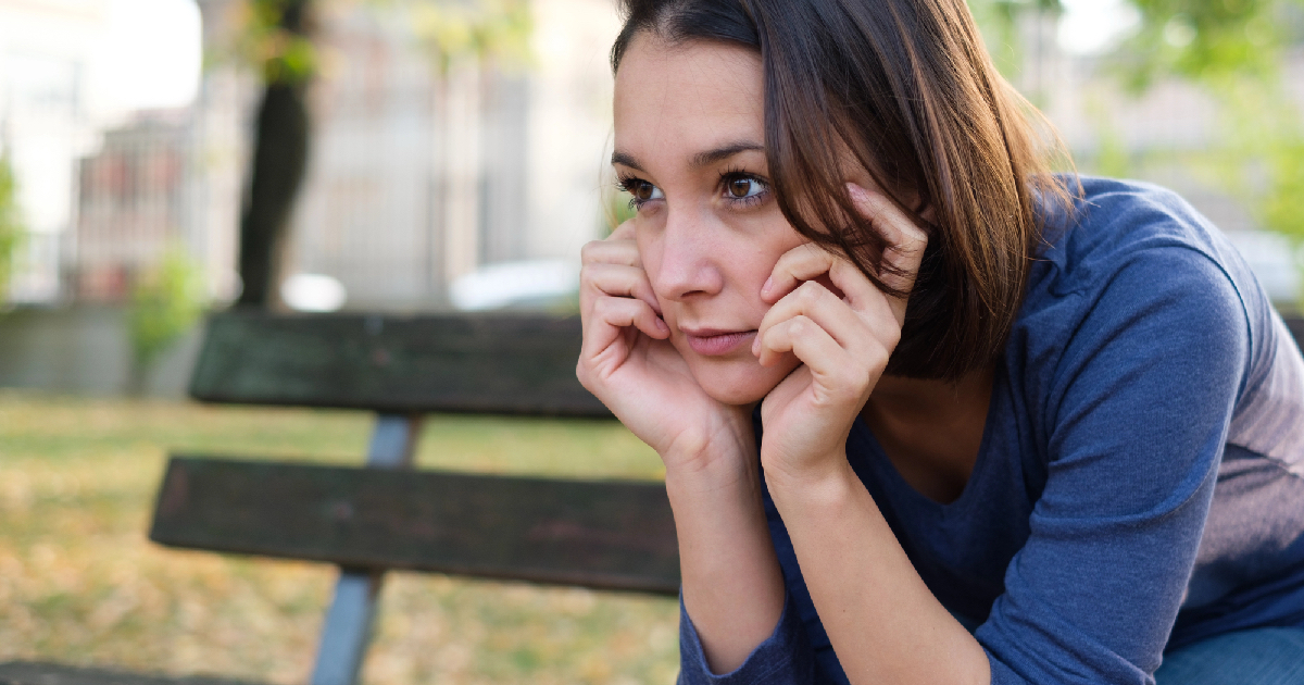 Young girl sitting on bench