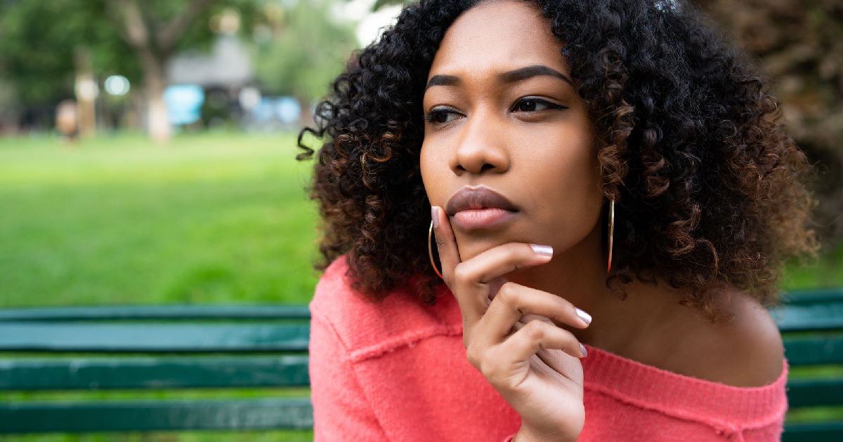 Beautiful African American woman sitting outside