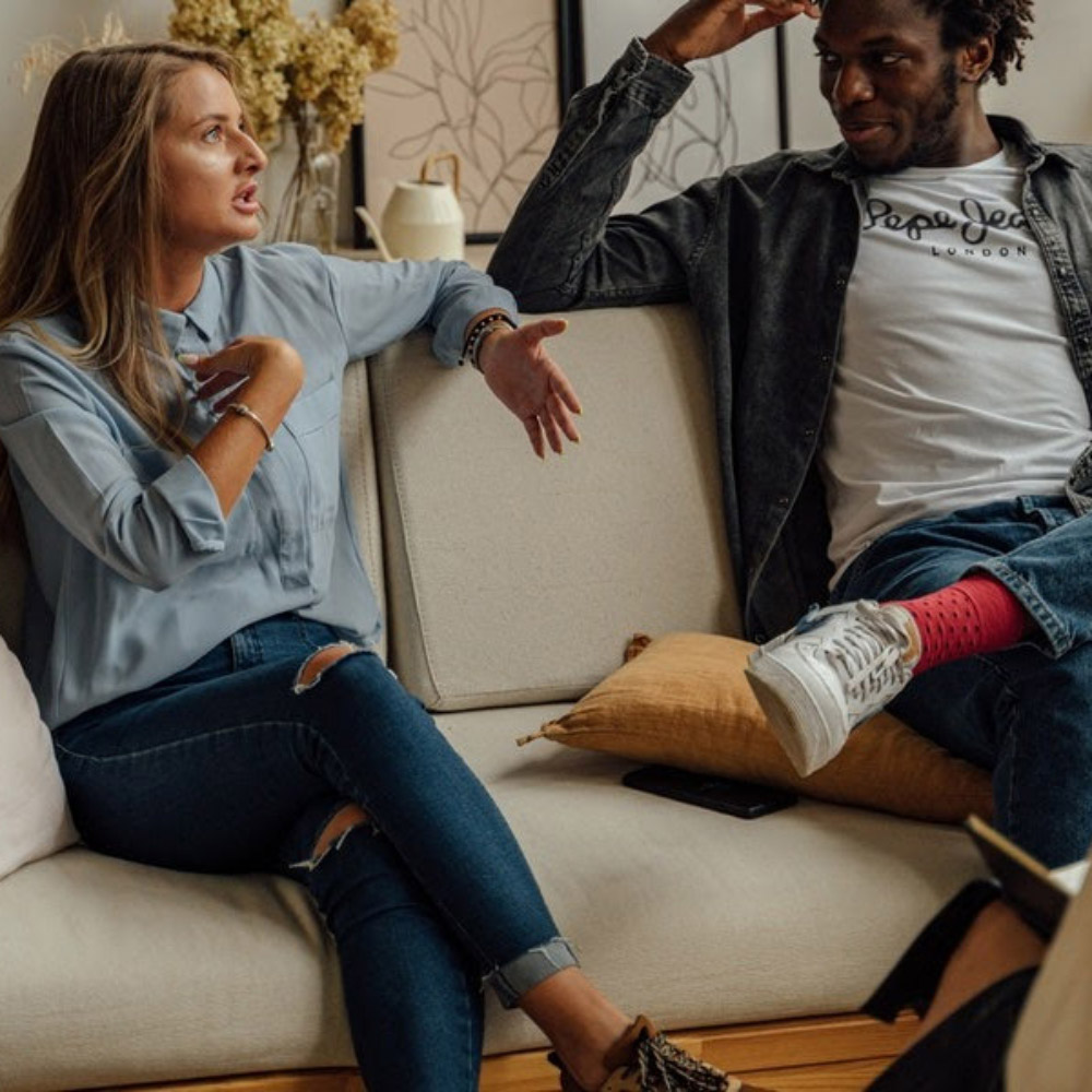 A woman talking at a couple's therapy session.