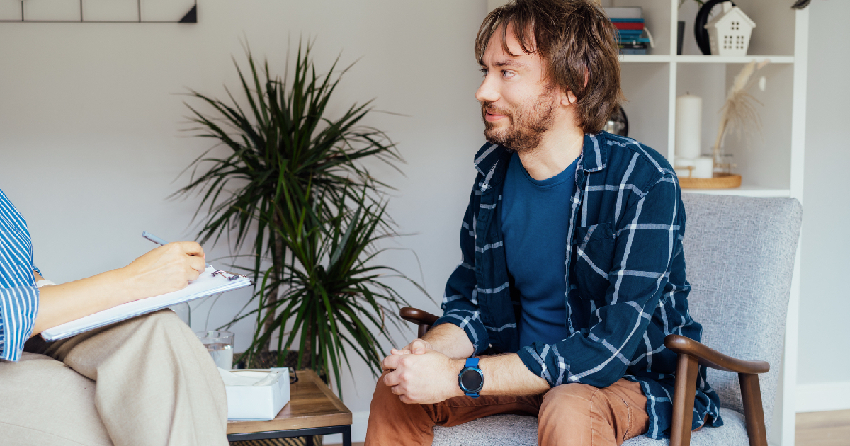 Young man sitting in therapy session