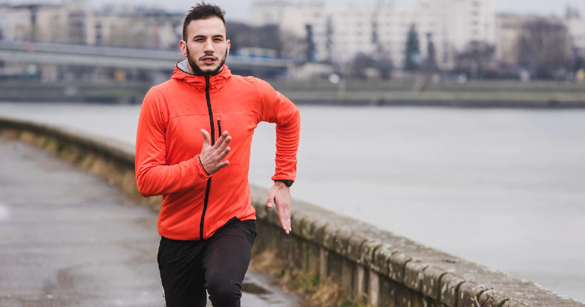 Man running in the city on a dreary day