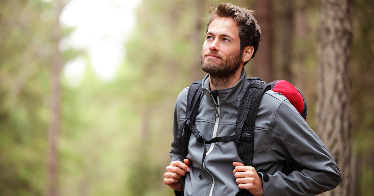 Young man wearing backpack in the outdoors