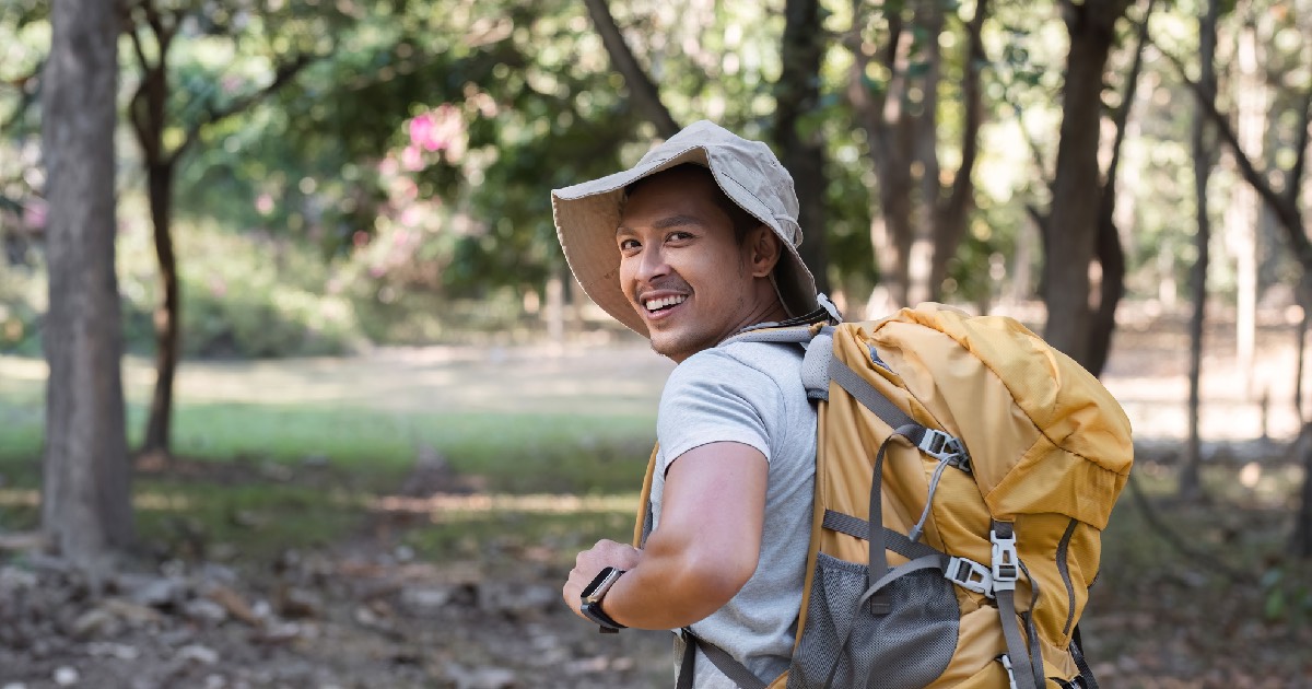 Man backpacking outdoors 