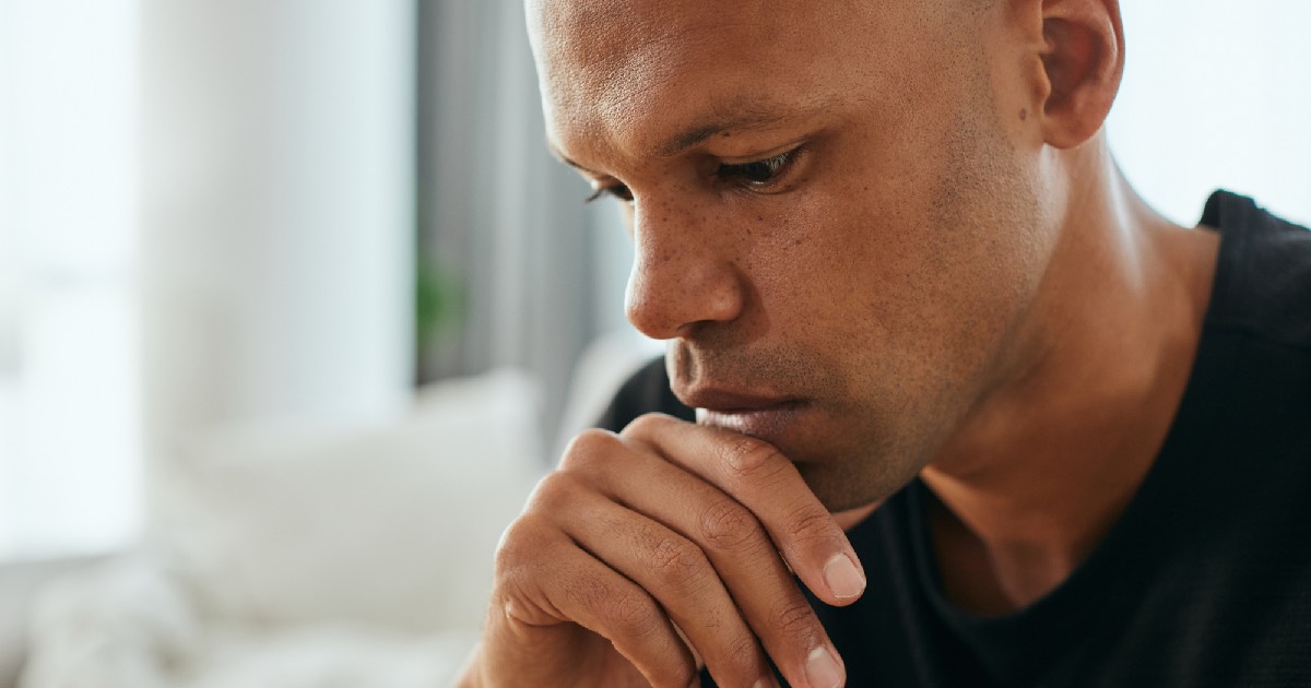 Pensive looking man wearing black shirt
