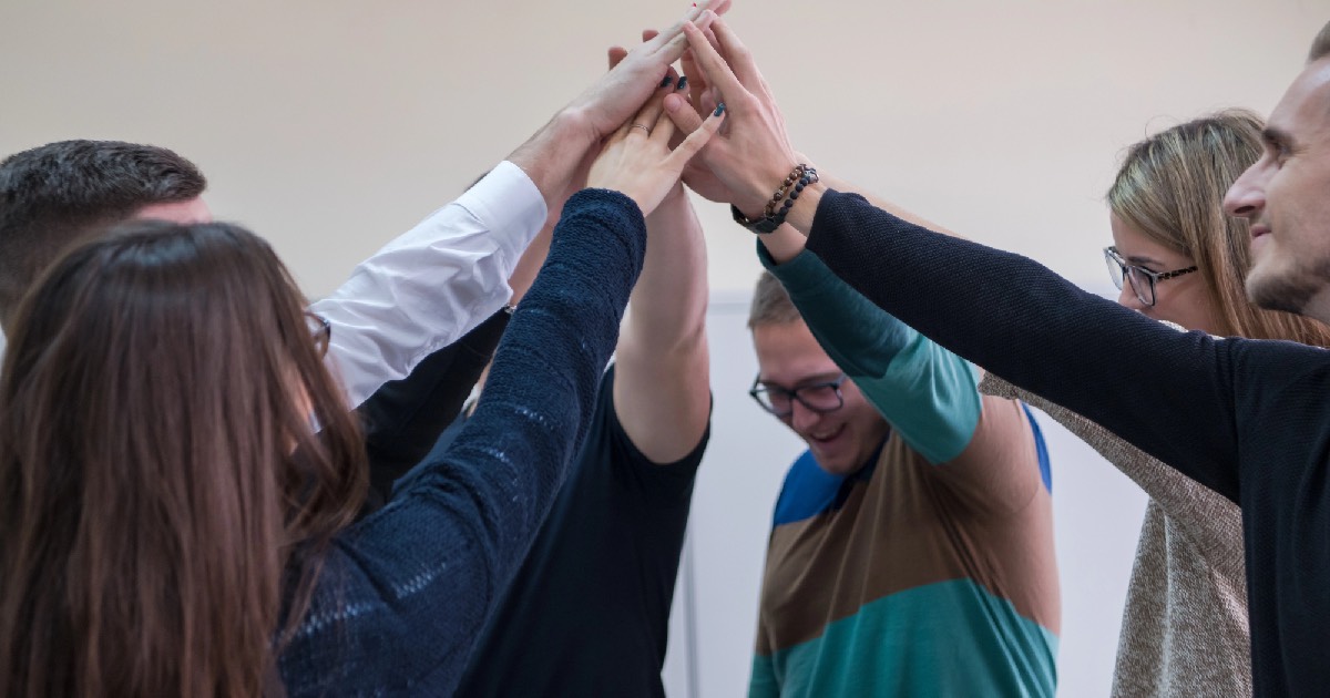 Group of people supporting each other